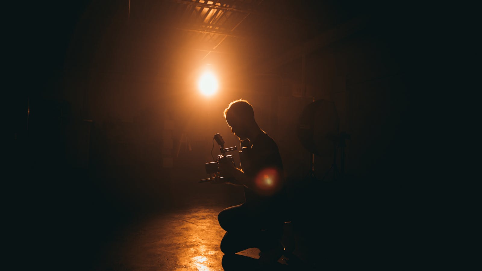 Guitarist performing under stage lights during a live set