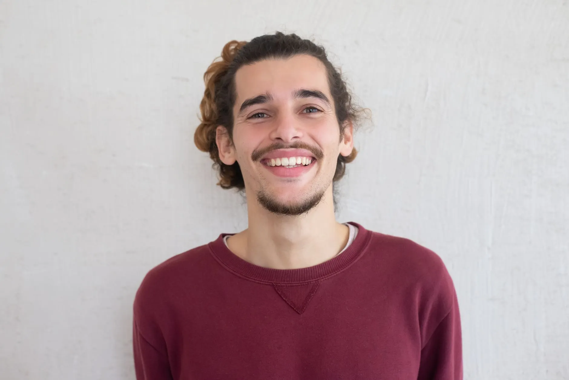Graduate smiling during a milestone portrait session