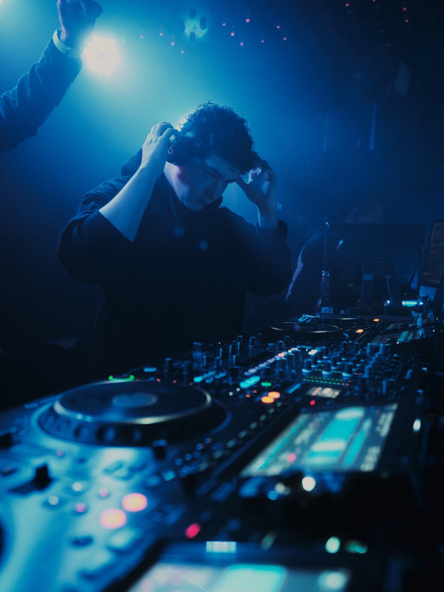 DJ performance under nightclub lighting